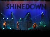 Rock band Shinedown performing at a concert.