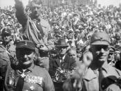 Hitler (left), standing behind Hermann Göring at a Nazi rally in Nuremberg (c. 1928)