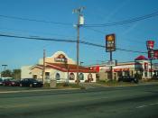 English: Older design of Taco Bell restaurant currently in use, adjacent to sister Yum Brands restaurant KFC, near Burlington.