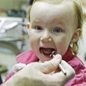 English: A little girl has her first visit to the dentist.