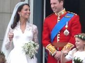 The British royal family on Buckingham Palace balcony after Prince William and Kate Middleton were married. Kate wears a wedding gown by Sarah Burton.