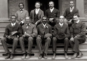 English: George Washington Carver (front row, center) poses with fellow staff members at the Tuskegee Institute (now known as Tuskegee University) located in the U.S. state of Alabama.