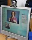 English: View showing a Video Relay Service session on a monitor, where a Deaf, Hard-Of-Hearing or Speech-Impaired individual can communicate with a hearing person via a Video Interpreter (a Sign Language interpreter), using a videophone or similar video 