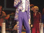 Porter Wagoner singing at the Grand Ole Opry in Nashville, Tennessee, USA.