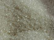 English: Raw (unrefined, unbleached) sugar, bought at the grocery store. Nederlands: ongeraffineerde ruwe suiker.