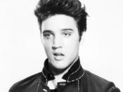 A cropped photograph depicts singer Elvis Presley's bust.