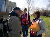 English: Clay County, MN, April 25, 2009 -- Red Cross workers Connie Eggers (r) and Chris Bauer (c) talking with a riverfront resident near Moorhead, MN; FEMA federal partners like the Red Cross deploy teams to specifically address disaster related stress