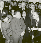 English: Deng Xiaoping, Vice Premier of the People's Republic of China state council, and his wife are briefed by Johnson Space Center director Dr. Christopher C. Kraft. A complete review of NASA's manned space program was given, using exhibit scale model