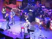 English: Faces at a reunion concert, Royal Albert Hall, London, October 2009. Pictured are Ronnie Wood, Mick Hucknall, Bill Wyman, Andy Fairweather-Low, Ian McLagan and Kenney Jones on drums.