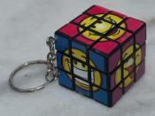 English: Novelty keychain version of the Rubik's Cube with smiley faces on the sides. Won at carnival.