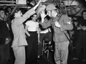 Signalman Owen Dolan (left) and Leading Seaman Chuck Roman celebrate the news of D-Day aboard H.M.C.S. PRINCE DAVID, 9 June 1944