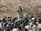 A mullah of Day Kundi speaks to a crowd of villagers on the final day of Ramadan in the province of Day Kundi, Afghanistan, Sept. 20. Photo by 55th Combat Camera