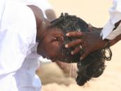 A woman being baptised in Benin.