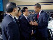 English: President Barack Obama talks with Chinese President Hu Jintao during the morning plenary session of the G-20 Pittsburgh Summit at the David L. Lawrence Convention Center in Pittsburgh.