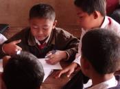 Primary pupils in group work in a small village school in southern Laos