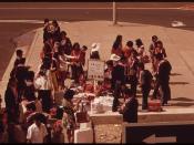 Honolulu International Airport handles almost all of the island's visitors. Some 2.7 million are anticipated in 1973. Welcomed with leis tourists now wait for bus to their hotel, October 1973