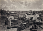 Atlanta, Georgia shortly after the end of the American Civil War showing the city's railroad roundhouse in ruins. Albumen print.