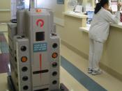 Pyxis Helpmate pharmacy robot delivering to a nurse's station at