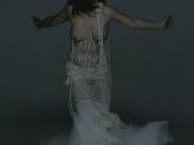 Björk wearing an in-body-pierced-wedding dress in the Pagan Poetry music video.