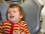 fearfull and crying child before dental treatment