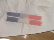 English: Blue (top) and red (bottom) litmus paper. When litmus paper is placed in acid, the red stays red (bottom right) and the blue turns red (top right). When litmus paper is placed in base, the blue stays blue (top left) and the red turns blue (bottom