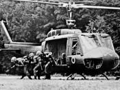 English: A U.S. Army rifle squad from the Blue Team of the 1st Squadron, 9th Cavalry exiting from a Bell UH-1D Huey helicopter in Vietnam. The 1st Squadron, 9th Cavalry Regiment was the air cavalry reconnaissance squadron of the 1st Cavalry Division throu
