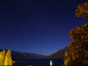 Starry night sky over Queenstown N.Zealand - the Southern Cross constellation and a meteor streak was visible