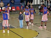 Harlem Globetrotters, are playing with a spectator during a game