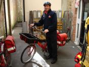 English: Royal mail bicycle messenger in Ilminster, UK