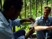 Solomon Water volunteer and his counterpart Josh Torenn test for particles in Honiara’s main water supply at the Kongulai water source.