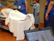 English: SAN DIEGO (Oct. 13, 2010) A laptop is used to control a training mannequin's vital signs during a mock code blue drill at the pain management clinic at Naval Medical Center San Diego. Mannequins offer health care providers the opportunity to prac
