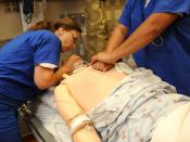 English: SAN DIEGO (Oct. 13, 2010) Nurse Elizabeth Stewart, left, and Health Technician Jennifer Barreiro perform cardiopulmonary resuscitation on a mannequin during a mock code blue drill in the pain management clinic at Naval Medical Center San Diego. M