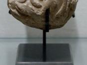 Globular envelope with a cluster of accounting tokens. Clay, Uruk period. From the Tell of the Acropolis in Susa.