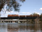 An Australian Railroad Group L class locomotive crosses the Swan River at Guildford.
