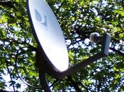 A standard DirecTV satellite dish with Dual LNB on a roof