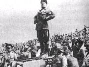Il Duce standing on top of a tank.