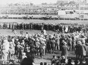 English: Phar Lap winning the Melbourne Cup Race from Second Wind and Shadow King on 5th November, 1930. Shows horses going over the finishing line viewed from over the heads of the crowd.