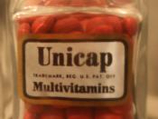 A glass container filled with the multivitamin Unicap, the product is made by the Upjohn company in Kalamazoo, MI. This is now an addition to the Kalamazoo Valley Museum.