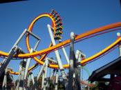English: The Silver Bullet Coaster at Knotts Berry Farm going through a loop and people going upside down