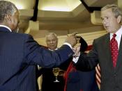 U.S. president Bush and South African president Mbeki, touching glasses during the former's visit to South Africa and other African countries, July 2003.