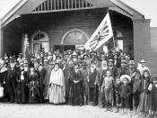 Maori group in the porch at the opening of the large two-storied Parliament house of the Kotahitanga movement at Pāpāwai, Greytown, New Zealand; Richard John Seddon stands to the left of the group. 1897. Pāpāwai was the seat of the Maori Parliament in the