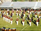 English: The Oakton High School (Oakton, VA) color guard performing with the Oakton Marching Cougars at the Lee-Davis Invitational competition (Lee-Davis High School, Mechanicsville, VA), fall 2001.