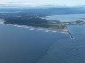 English: Cape Disappointment, Washington, at the mouth of the Columbia River on the Pacific Ocean. View is to the northeast. The town of Ilwaco, Washington is at upper center. The Pacific Ocean is in front and the mouth of the Columbia is at right. The so
