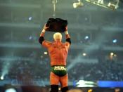 Mr. Kennedy retrieving the Money in the Bank briefcase