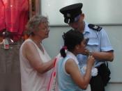 A woman asking a Hong Kong policeman for directions.