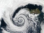 A large extratropical low-pressure system swirls off the southwestern coast of Iceland.