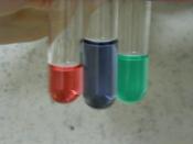 English: Cobalt chloride in various stages of equilibrium with hydrochloric acid