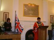 A British citizenship ceremony in 2005, at the London Borough of Tower Hamlets. The Mayor of Tower Hamlets is shown.