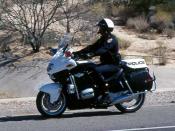 A motor officer patrolling in Arizona on a BMW 