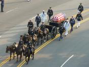 Ronald Reagan's casket, on a horse-drawn caisson, being pulled down Constitution Avenue to the Capitol